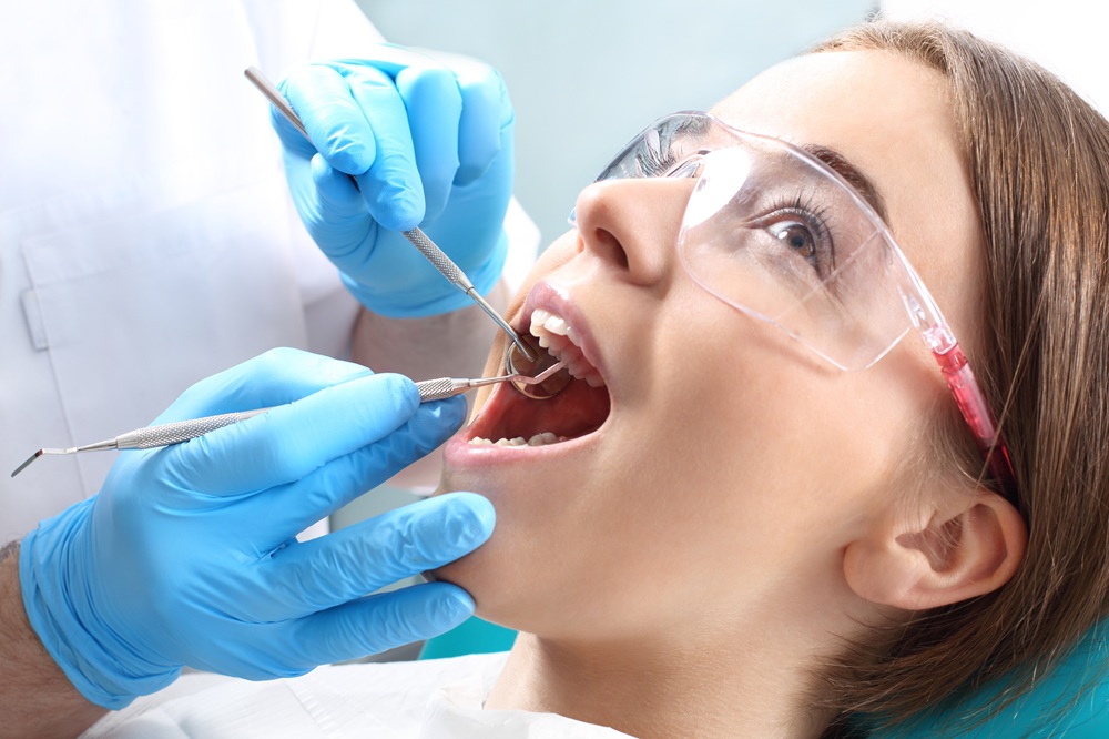 Professional Dental Cleaning Procedure – Dental Cleaning in Seattle A dental hygienist performs a professional cleaning, removing plaque and tartar buildup to help the patient maintain a healthy, bright smile. – Dental Cleaning in Seattle